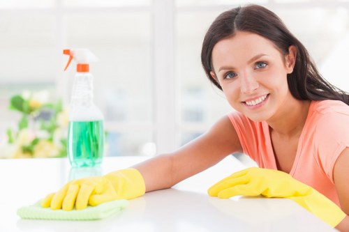 Carpet cleaning staff using safe work practices and protective equipment